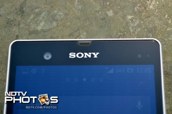 The front camera lens, sensors and a notification LED are placed above the screen along with Sony branding.