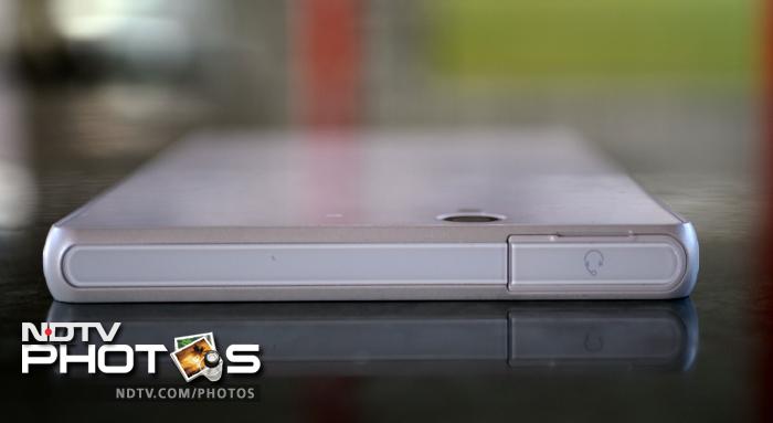 The top features a 3.5mm headphone jack, and is also covered with a flap.