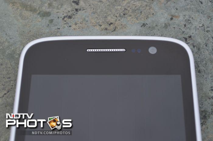 The earpiece grill, sensors and the 2-megapixel front camera sit above the screen.