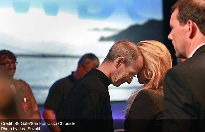 Steve Jobs rests his head against his wife, Laurene Powell Jobs, after delivering the keynote address to the Apple Worldwide Developers Conference at Moscone West on Monday.