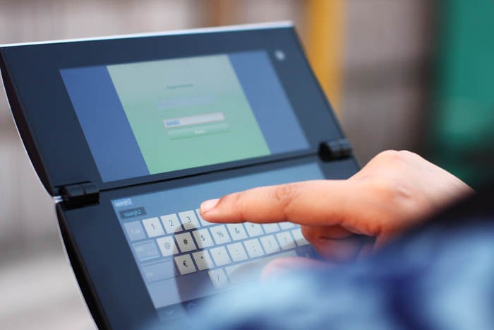 The keyboard on the Tablet P pops up on the lower screen whenever you need to type.