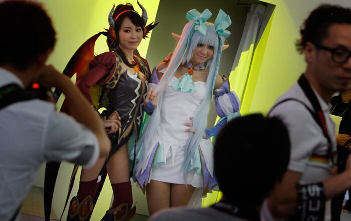 Visitors participate in a photo session of "Cosplay" characters at the Tokyo Game Show in Makuhari, Japan,  Thursday, Sept. 16, 2010.    

(Photo: AP)
