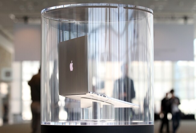 The new MacBook Pro is displayed in a case following the keynote address at the Apple 2012 Worldwide Developers Conference (WWDC). Apple unveiled a slew of new hardware and software updates at the conference which runs through June 15.