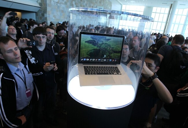 WWDC attendees look at the new MacBook Pro at the Moscone Center.