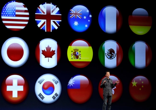 Scott Forstall shows flags representing different languages for the new iOS 6 software.