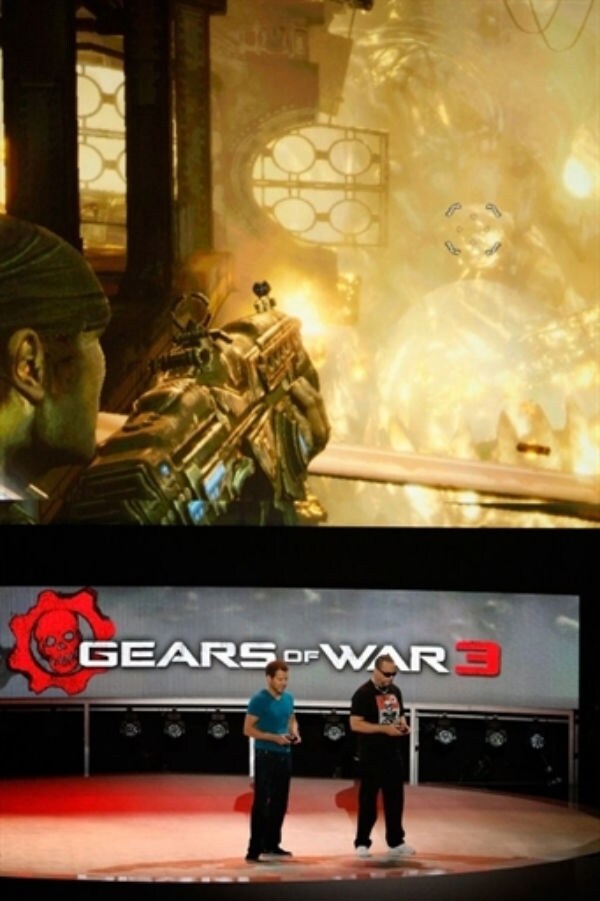 Cliff Bleszinski (L) and Rapper Ice-T demonstrate the Gears of War 3 game at the Electronic Entertainment Expo (E3). (Photo: AFP)
