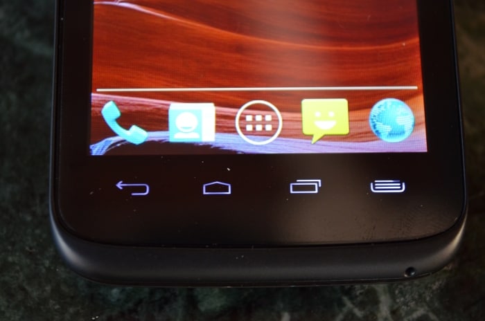 The phone has 4 capacitive touch buttons below the display.