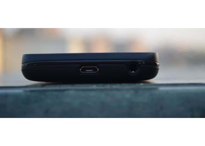 A micro-USB port and 3.5 mm headphone slot sits at the top.