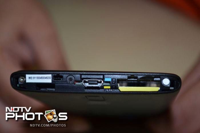 The microSD slot is placed adjacent to the SIM slot under the removable bottom strip.