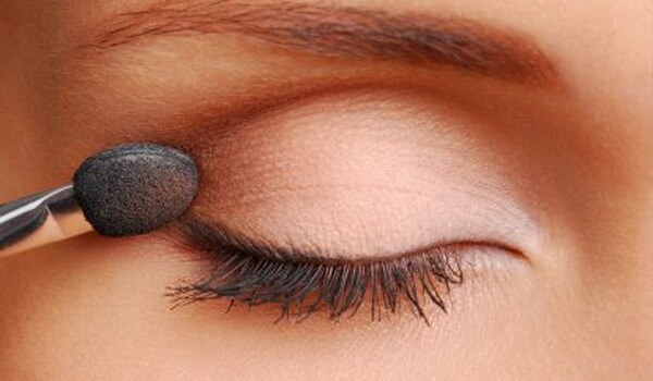 Insert contact lens before applying eye makeup and remove lenses before removing the makeup.