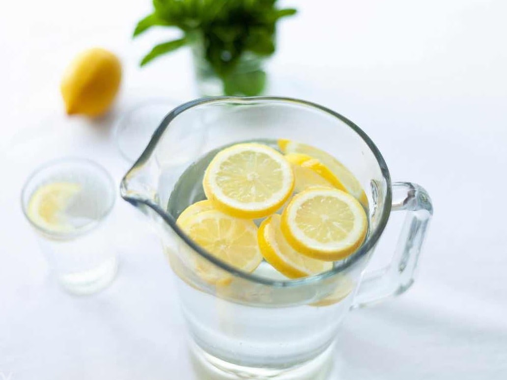 Lemon water stimulates digestion and acts as a natural diuretic, helping to flush out excess water and toxins. Warm water soothes the digestive system, promoting better digestion and reducing bloating.