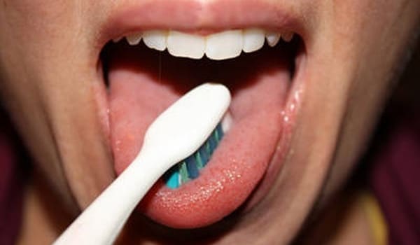 Gentle brushing of the tongue and the roof of the mouth helps remove germs and prevent bad breath.