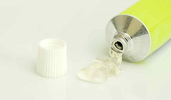 Use a lubricant. This will decrease friction and make the viral particles less likely to adhere to new locations.