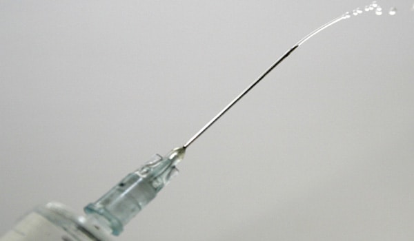 Pull the needle out and pat the area with the swab. Do not rub the site of injection. Dispose off the needle after use.