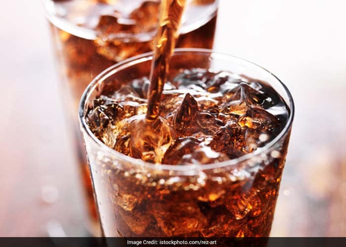 Sweetened drinks such as colas are very calorie dense. Since the calories are absorbed into the blood stream fast, the body stores the unwanted calories as fat.