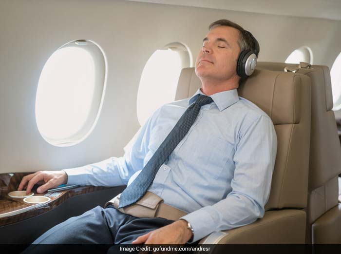 To prevent dizziness while travelling, keep your head still, while resting against a seat back.