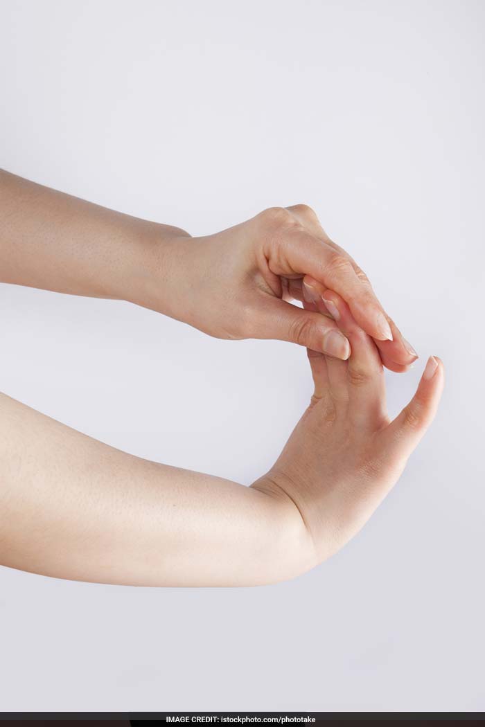 Wrist Stretch: Extend your right arm. Place your left hand under the right forearm. Spread the fingers of your right hand comfortably. Next, you can stretch your wrist up and down and in a clockwise and anticlockwise direction.