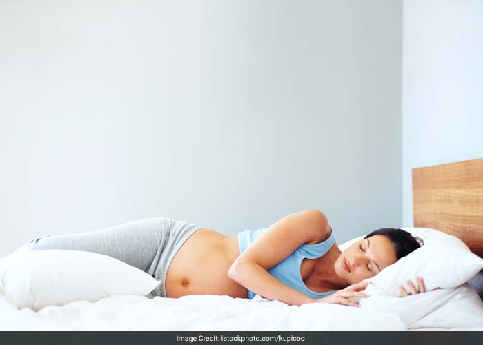 A firm mattress helps relieve back pain. Place a pillow under your knees to cut the pressure on your back. Lying on your side with a pillow between your knees also reduces the pressure.