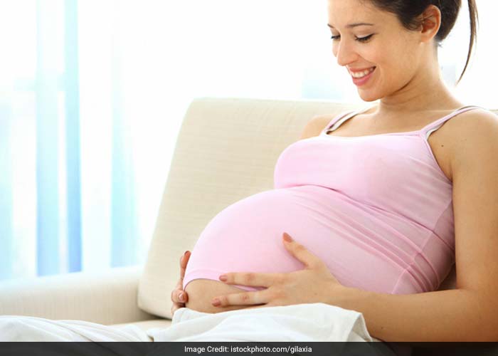 Pregnancy takes a toll on your back. Try not to stand for long periods of time. If you have to, keep one foot up on a stool with your knee bent in order to prevent straining your lower back.