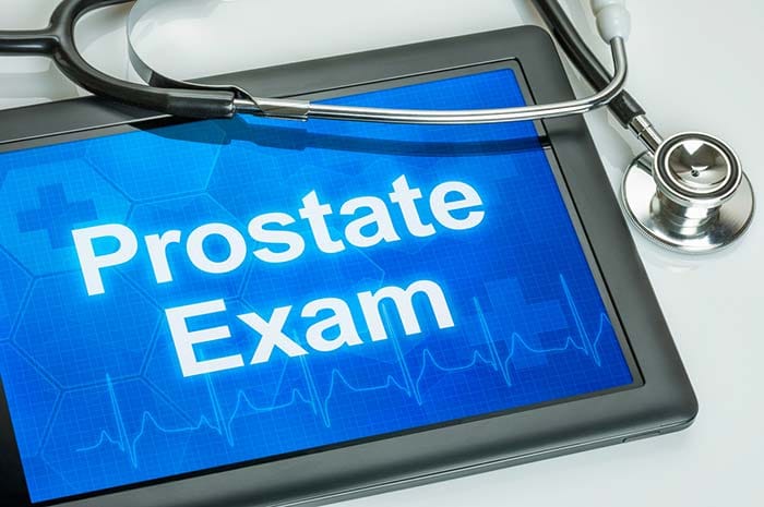 Middle aged man should undergo a digital exam of his prostate. The physician uses a gloved finger in the rectum to determine if there is any enlargement of the prostate.