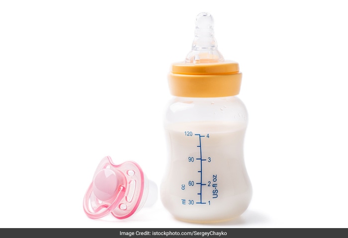 Express breast milk during work in a clean container for storage to be given to the baby later on or discard to relieve heaviness. This will ensure adequate milk production.