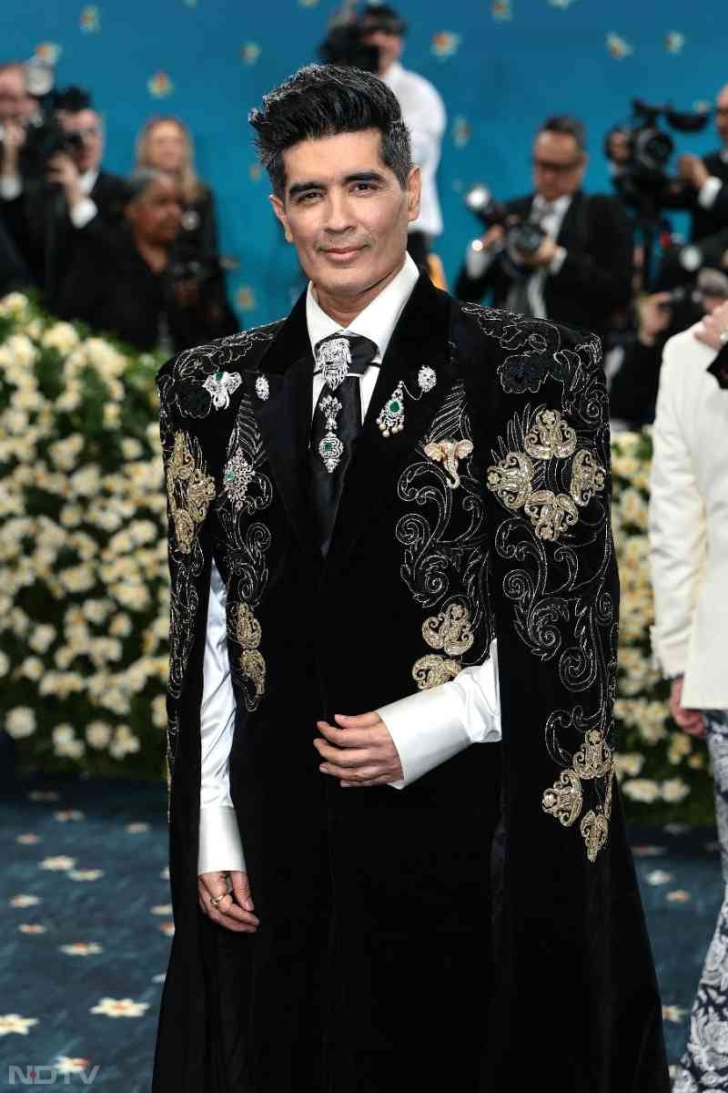 Manish Malhotra's Met debut was iconic as he strutted in wearing a sculpted black sherwani cape studded with embellishments and layered with intricate embroidery.