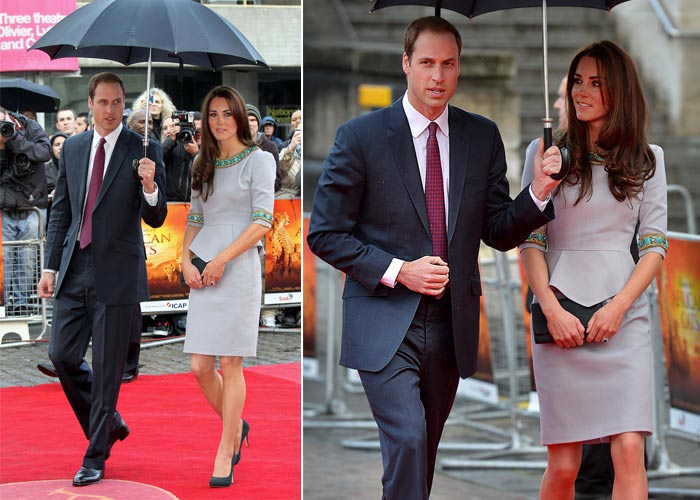 True gentleman - Prince William protects wife Kate from the rain.