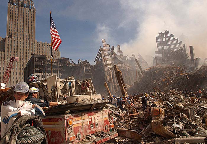 In this photo obtained on September 18, 2001 from the Federal Emergency Management Agency (FEMA), firefighters and Urban Search and Rescue workers battle smoldering fires as they search for survivors at the ruins of the World Trade Centre. (AFP Photo)