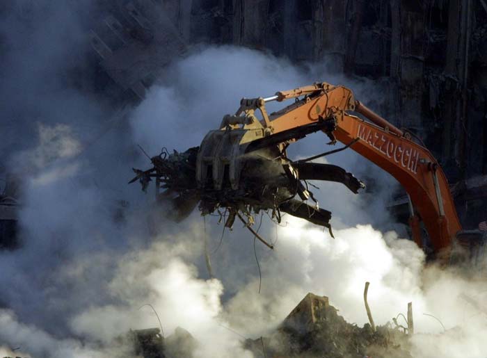 Debris is cleared from the still smouldering rubble of the terror destroyed World Trade Centre on October 12, 2001 in New York. (AFP Photo)