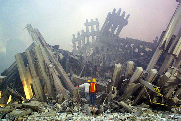 Rescue workers survey the damage. (AFP Photo)