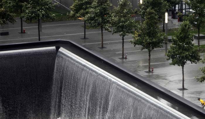 A man walks past a memorial pool at ground zero in New York, Wednesday, Sept. 7, 2011. (AP Photo)