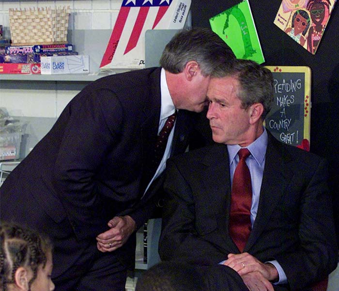 In this Tuesday, Sept. 11, 2001 file photo, Chief of Staff Andrew Card whispers in George W Bush's ear that 'America is under attack' during a visit to the Emma E. Booker Elementary School in Sarasota, Florida. (AP Photo)