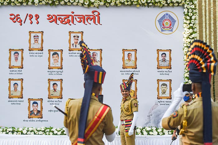 Police officers pay tribute to the victims at the Police Martyrs Memorial to mark the 13th anniversary of the 26/11 terror attacks, in Mumbai.