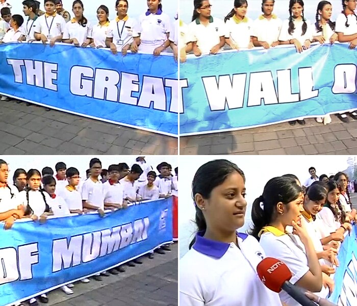 As part of a series of events planned across Mumbai, school students from the city came to the Trident Hotel to show solidarity with Mumbai's citizens. They were holding a 1.3-km long banner, which read 'The Great Wall of Mumbai'.