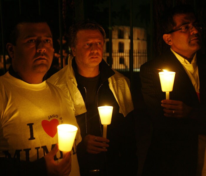 A week after terror struck the city, peace gatherings organised by several groups, including prominent citizens, are attracting large numbers of concerned Mumbaikars to the sites where the attacks were unleashed on unsuspecting victims claiming hundreds of lives and injuring several others. A tribute was paid to the police officials and commandos who lost their lives in the hands of terror. With every candle, a pledge was taken to raise voices against terror and crime. (AFP photo)