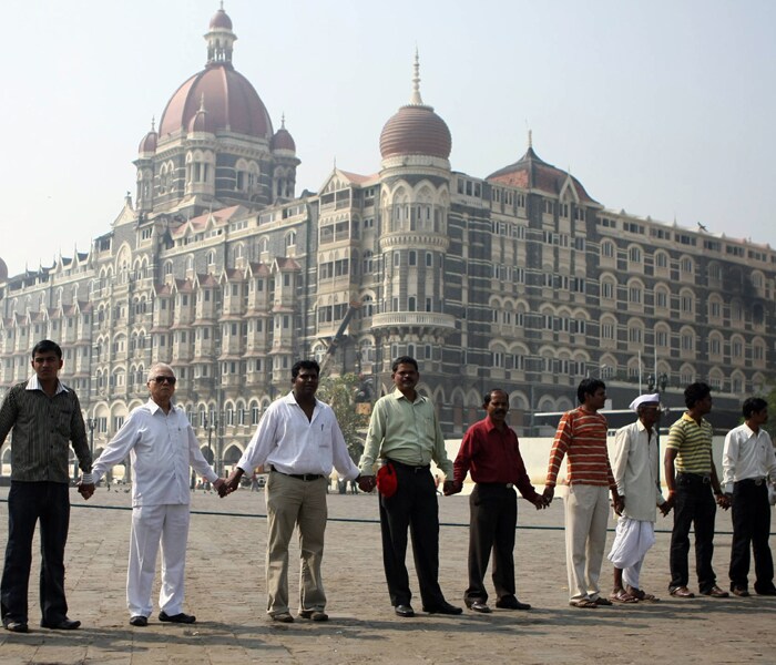 In what was possibly the largest terrorist attacks in recent Indian history, nearly 200 people were killed and over 300 injured in the Mumbai attacks on November 26, 2008. <br /><br />
A siege that lasted nearly 3 days, scarred Mumbai and Mumbaikars, possibly forever. Maharashtra as a state was affected, and after effects on the Indian government were observed. Also affected were the relations between India and Pakistan as well as the center and state relations within India. Through this photo gallery NDTV.com takes a look back at how life has changed for Mumbai in the last one year after these attacks.(AFP photo)