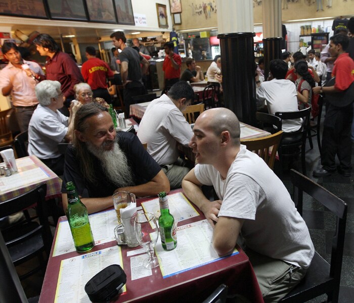 Just four days after the attacks, on November 29, 2008, Leopold caf� reopened to public. The blood was wiped off, broken window panes, shattered glass replaced. The only direction Leopold was looking at was forward. Restoration began at full pace, and although the entire caf� was rebuilt from within, a wall with bullet marks was still kept the way it was, in remembrance of those terror attacks.(AFP photo)