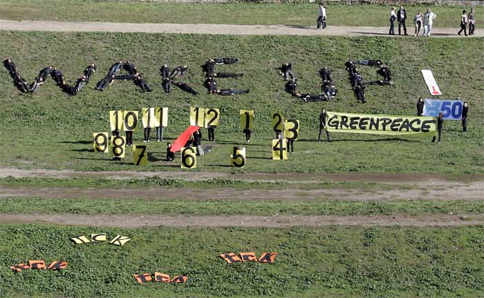 Activists from the Environmental group Greenpeace form the words &quot;wake up&quot; with their bodies as they call for action against climate change, during a demonstration in Rome's Circus Maximus, on Saturday. (AP)