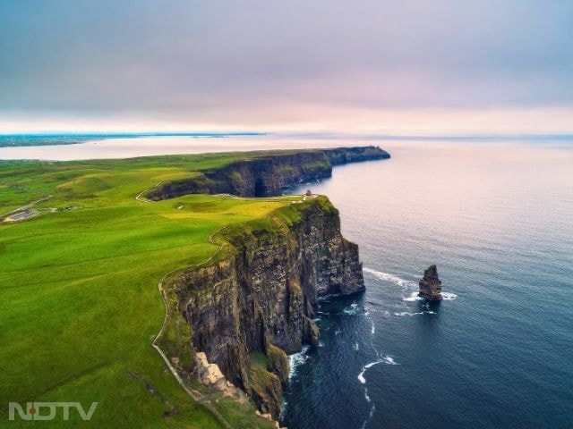 1. Visit the Cliffs of Moher: Ireland's Cliffs of Moher stretch 14 km along the Atlantic, rising over 700 feet. Sweeping ocean views and seabird colonies make it unmissable, while the visitor centre adds fascinating geological context.