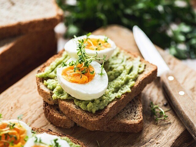 Toasted whole grain bread topped with mashed avocado, a sprinkle of salt and pepper, and a fried or poached egg on top is perfect for when you need a filling breakfast