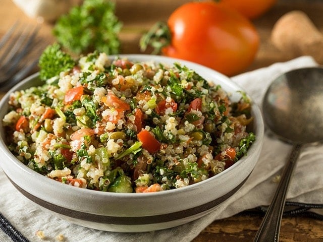 Cook quinoa and top it with cherry tomatoes, a fried egg, and a sprinkle of feta cheese for a nutritious start to your day