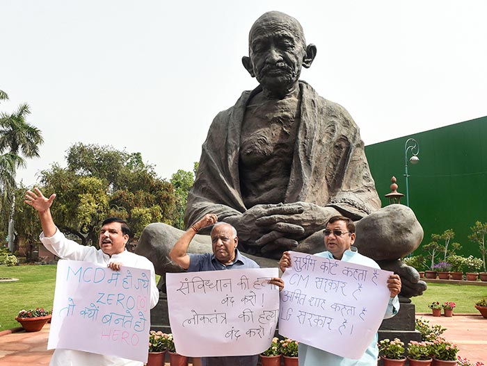 AAP MPs Sanjay Singh, Sushil Gupta, and ND Gupta stage a protest against the new NCT Delhi bill, during the Budget Session of Parliament, in New Delhi.