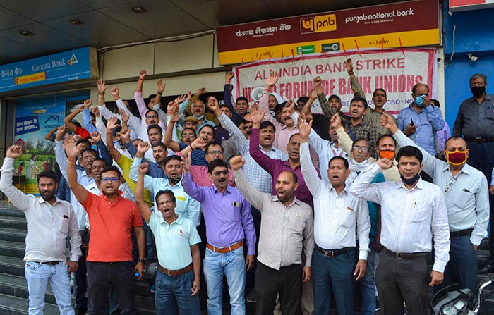 Bank employees raise slogans during a protest in support of the two-day nationwide strike, called by United Forum of Bank Unions (UFBU), against the proposed privatisation of two state-owned lenders, in Varanasi.