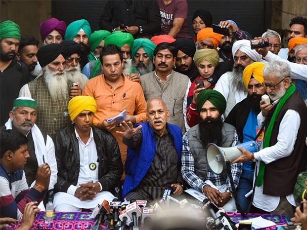 Farmers' leaders address the media after a meeting with representatives of farmer organisations regarding the Centre's farm reform laws, near Singhu border in New Delhi.