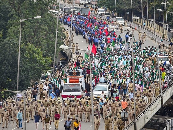 Karnataka farmers participate in a protest rally to press for repeal of the farm laws, in Bengaluru.