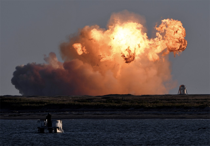 SpaceX's first super heavy-lift Starship SN8 rocket explodes during a return-landing attempt after it launched from their facility on a test flight in Boca Chica, Texas. (Reuters)