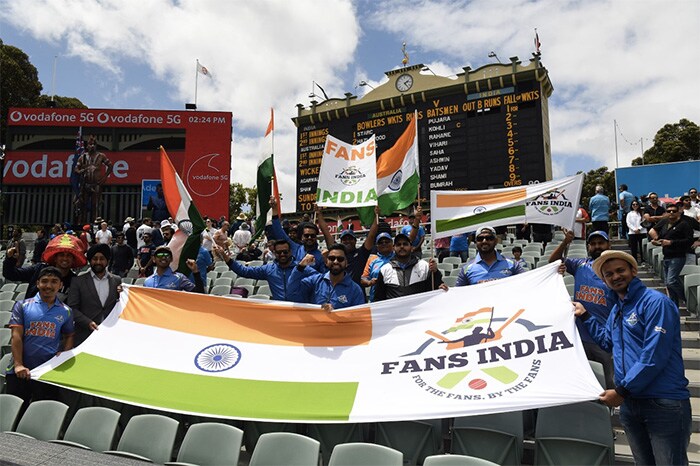 Indian fans watch the game on the first day of the cricket Test match between Australia and India in Adelaide.