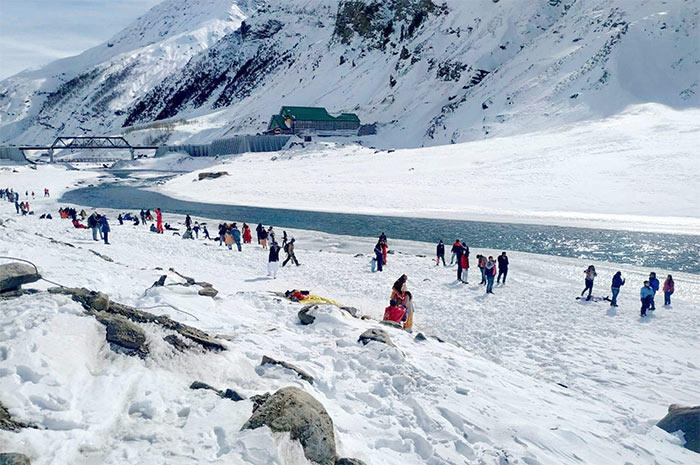 Tourists visit Rohtang Pass near Manali