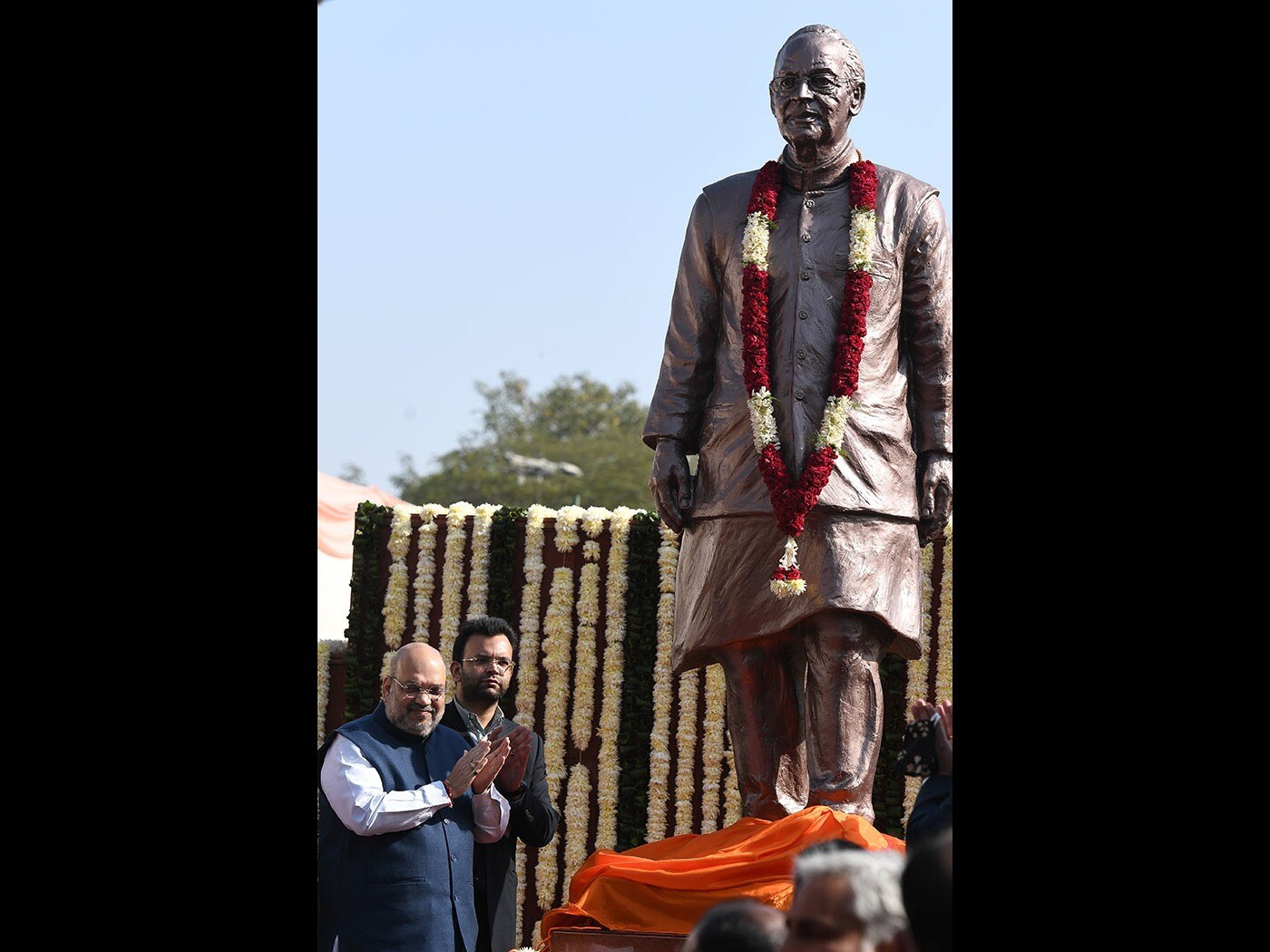 Home Minister Amit Shah applaud during a ceremony to unveil a statue of late Arun Jaitley, a former union minister at the Arun Jaitley Stadium sports ground in New Delhi.