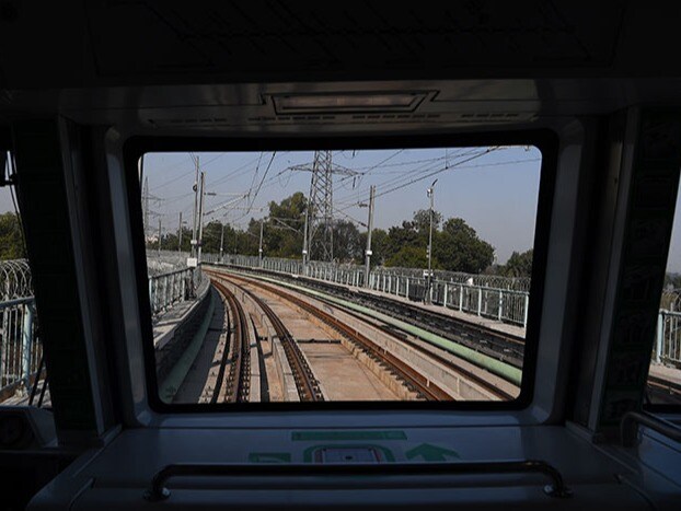 The metro train track is pictured from India's first driverless metro train during its inauguration in New Delhi